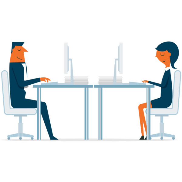 Image of two people working at their desks