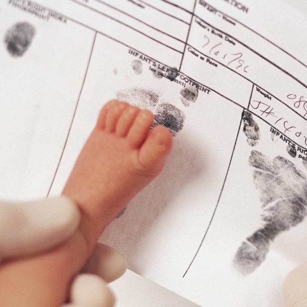 Image of a baby getting their footprint.