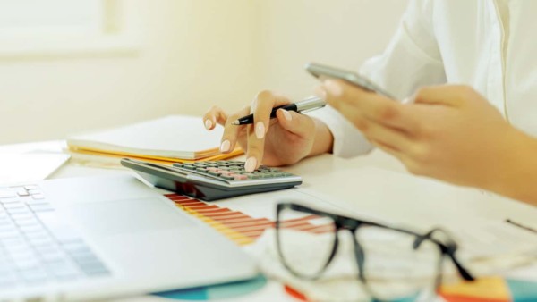Image of someone using a calculator.