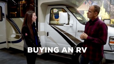 Image of Marcus Lemonis negotiating with someone looking to buy an RV.