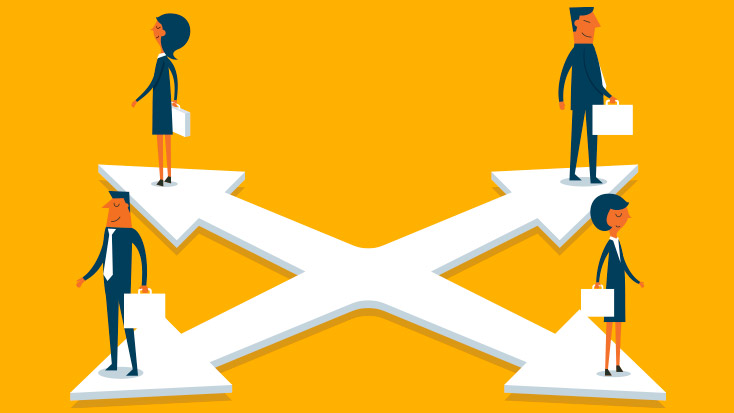 Image of four people standing on a crossed arrow.