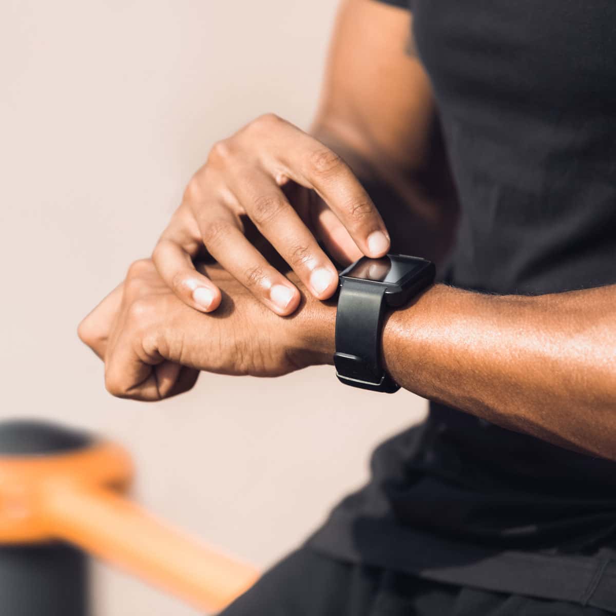 Image of someone using a fitness tracker watch.