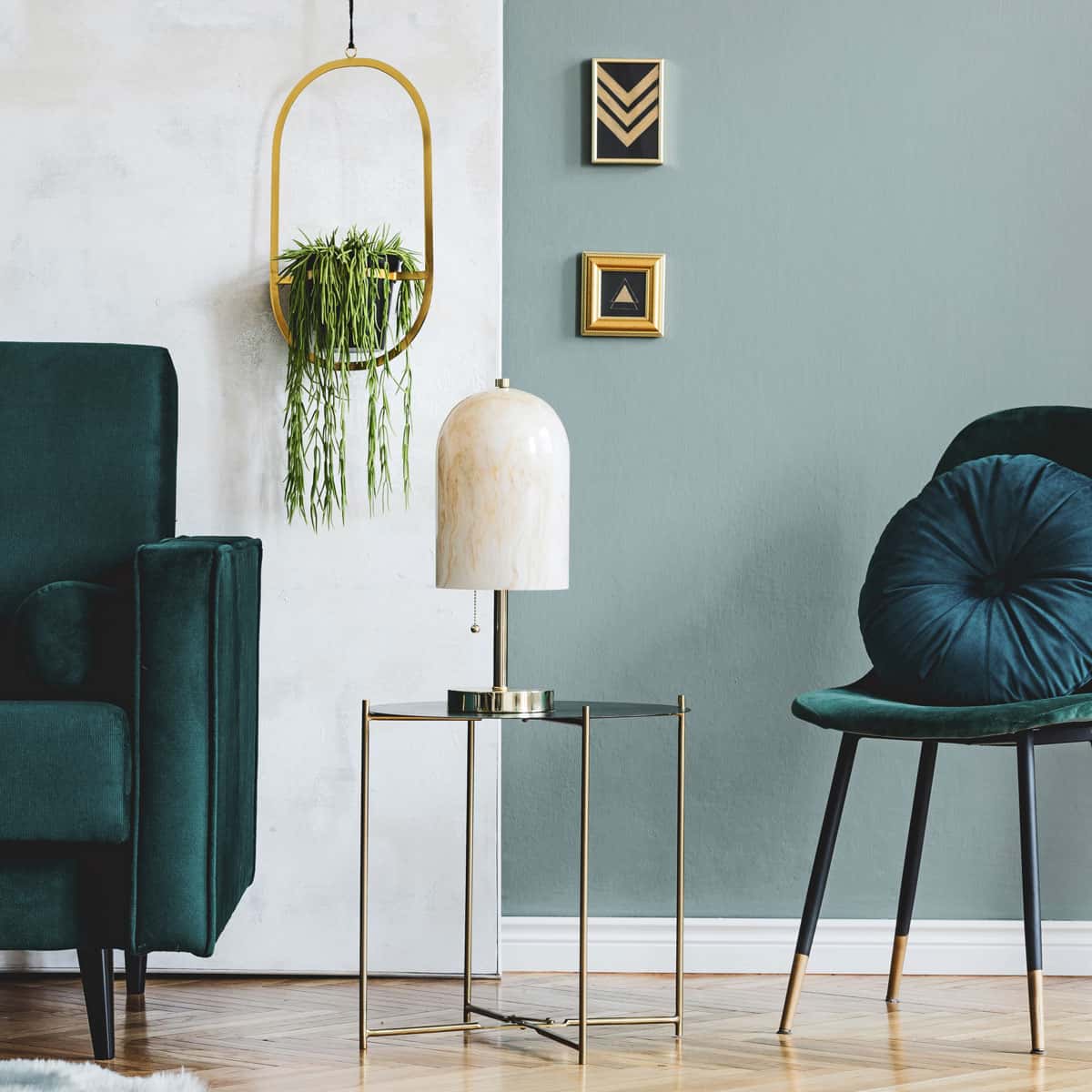 Gold chrome accents in frames and side table in vintage style home.
