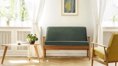 Green couch in vintage style home