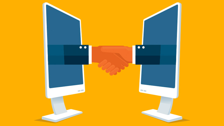 Hands shaking and making a deal through their computers