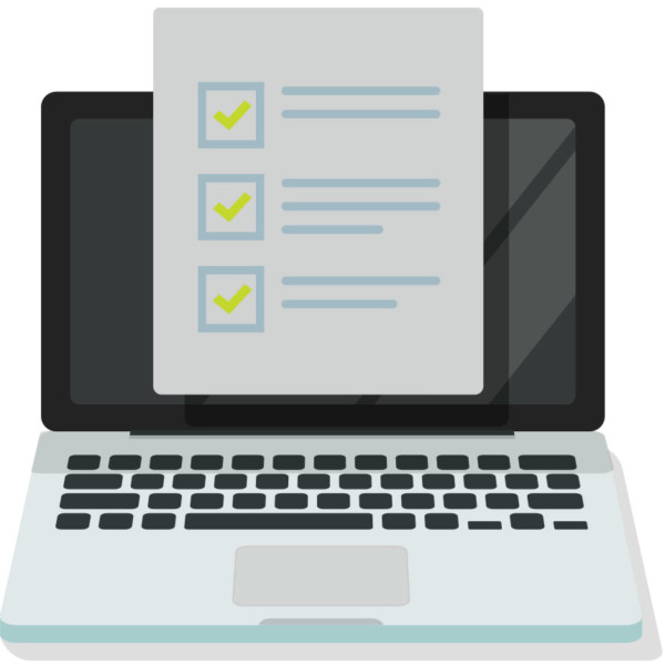 Image of a checklist in front of a laptop screen.