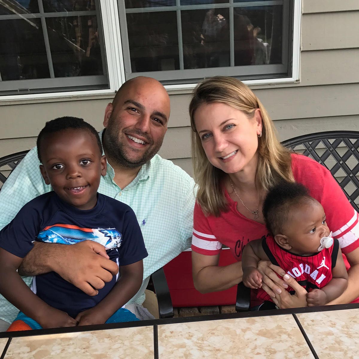 Image of a couple with adopted kids