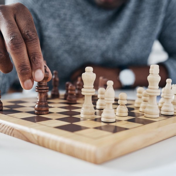 Image of someone playing chess.