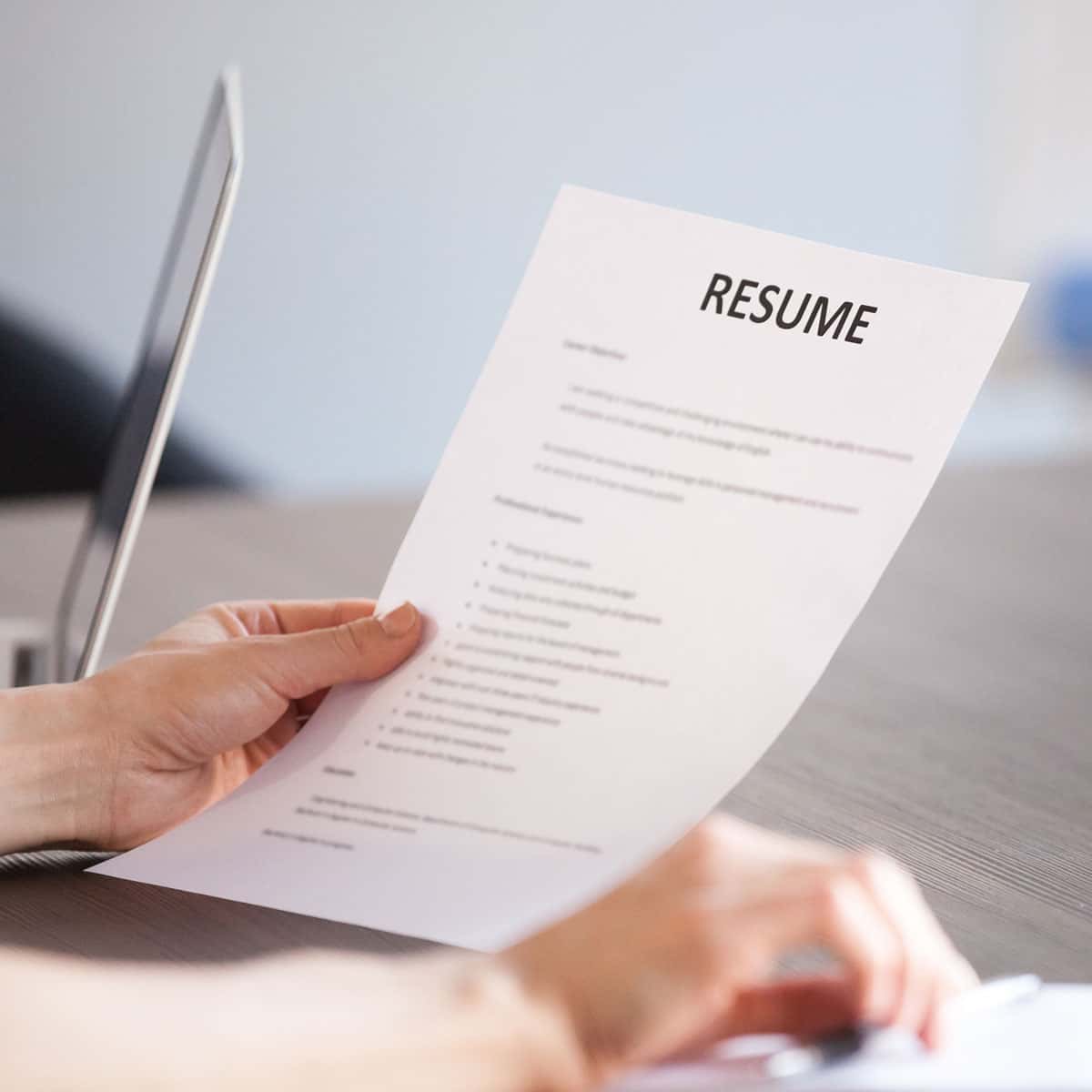person looking at their resume