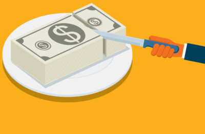 Slicing through money on a plate like its cake
