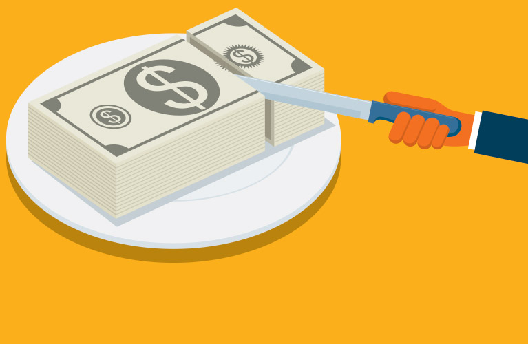 Slicing through money on a plate like its cake
