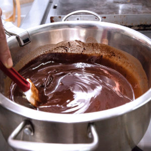 Stirring melted chocolate to get rid of lumps