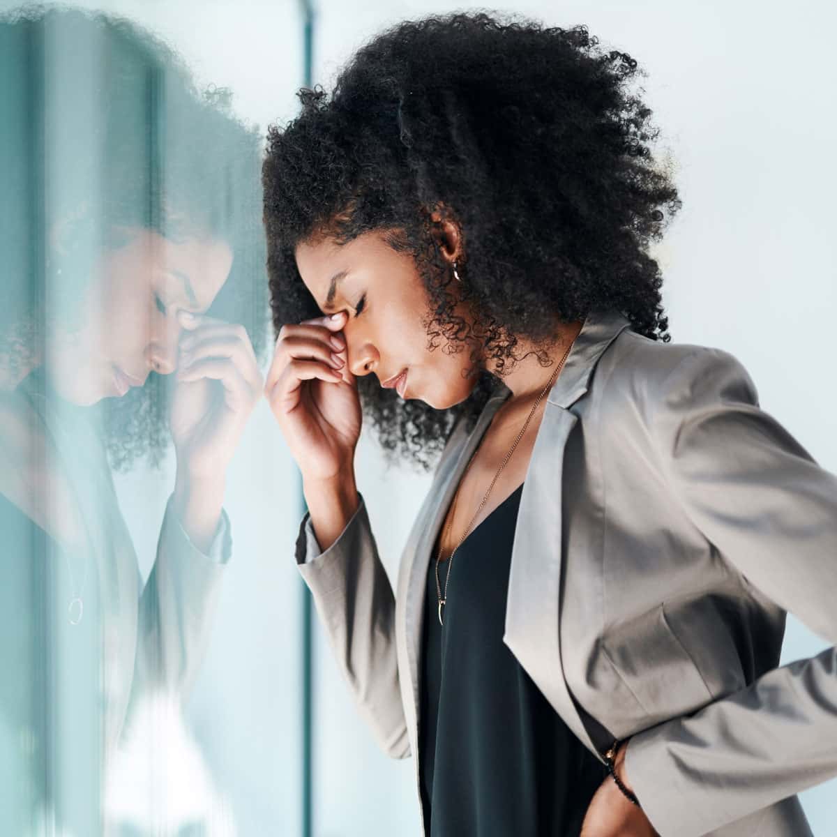 women stressed by a window