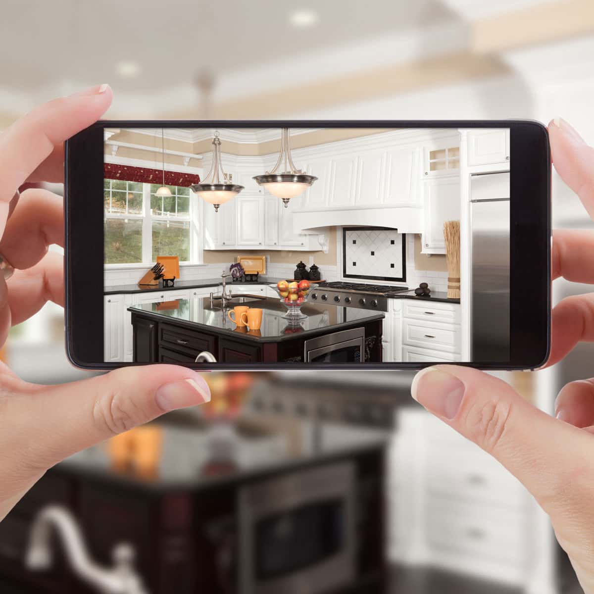 Taking a photo of the new kitchen on a phone