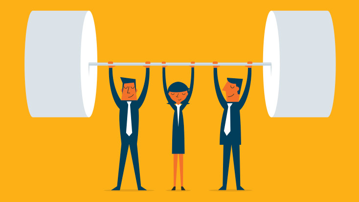 Image of three people lifting up a large weight.