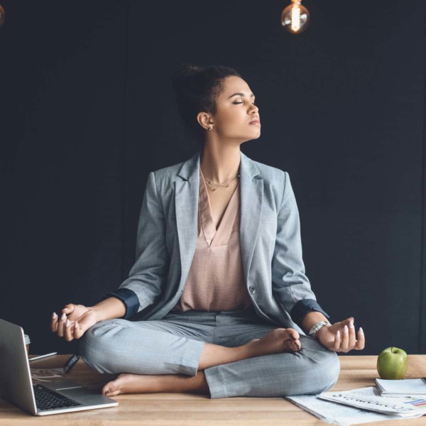 Woman meditating to relax at work