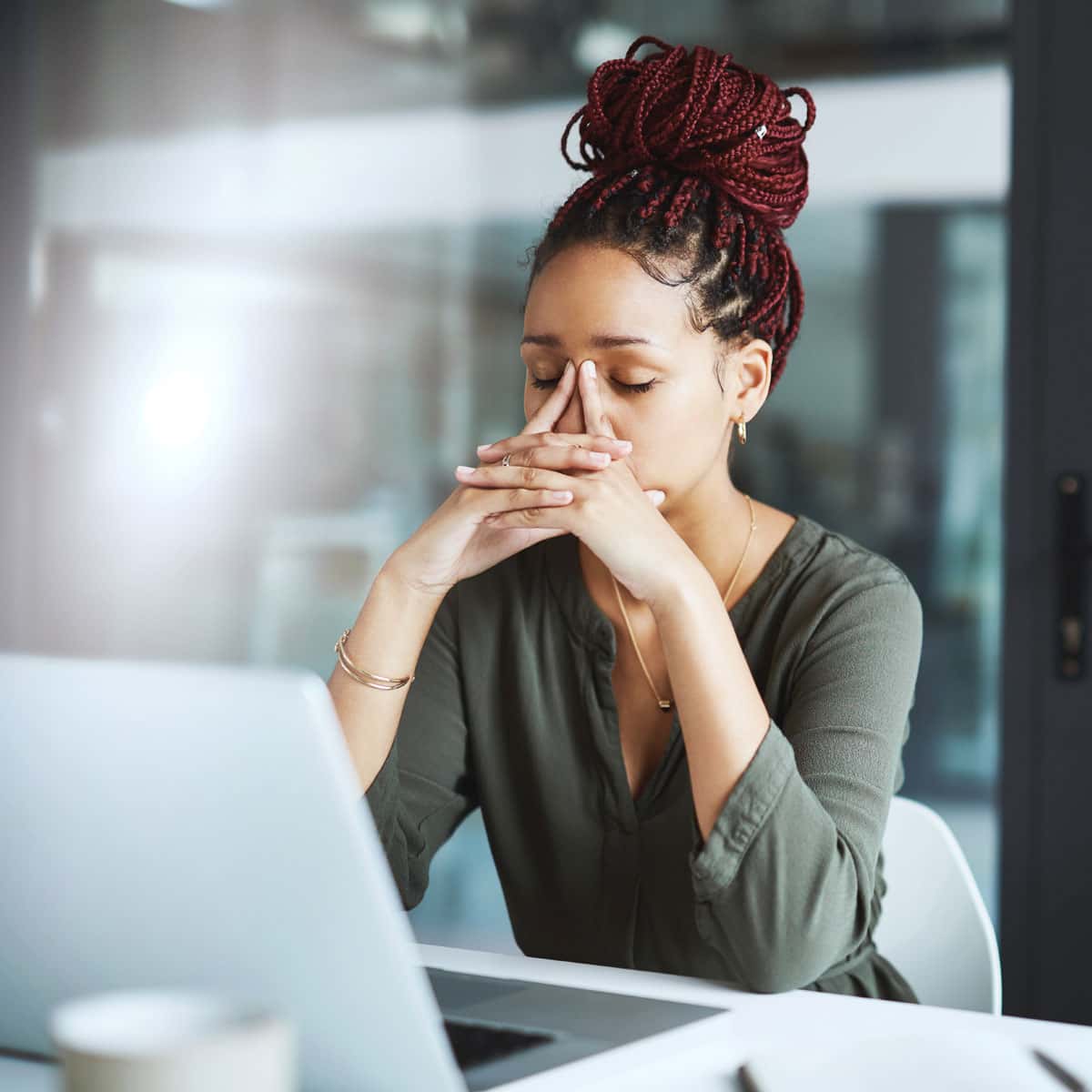 women stressed working on her computer