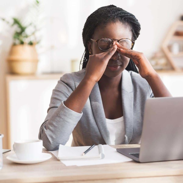 women stressed at her desk