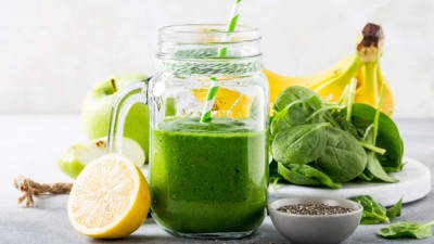 Image of a jar with some green colored smoothie.