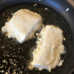 Image of food searing in pan