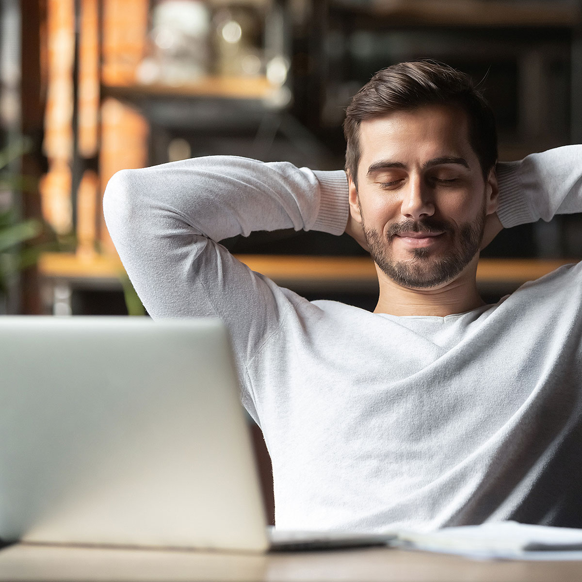 image of man relaxing and recognizing his progress towards success