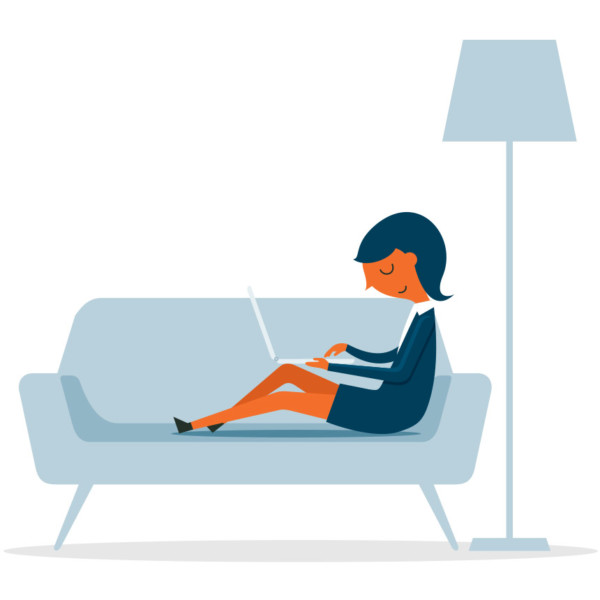 women on her couch reading content on her laptop