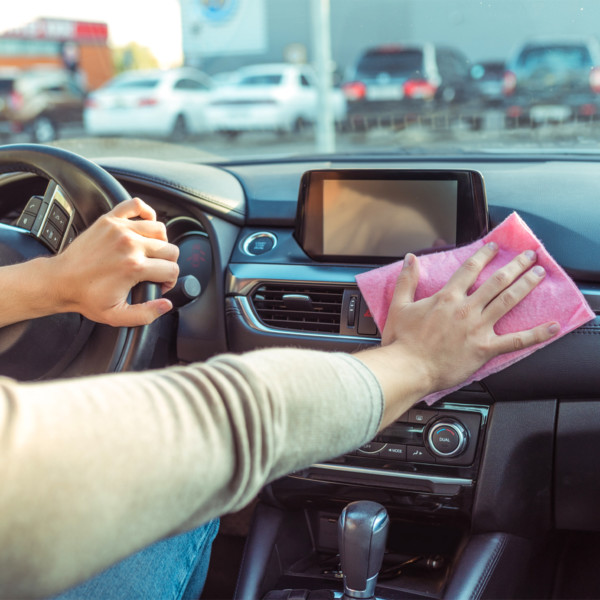 Cleaning inside of car with cloth