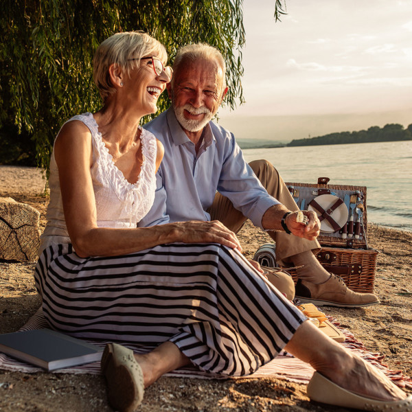 Image of an older couple on a date at the beach.