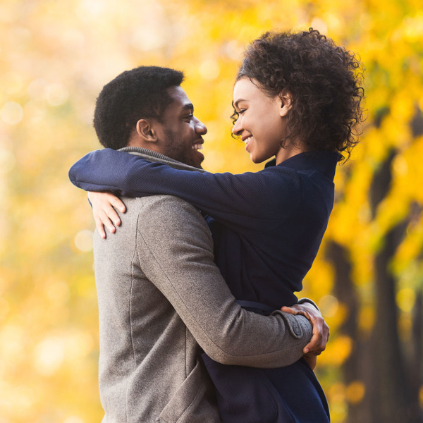 Image of a couple holding themselves in each other's arms.