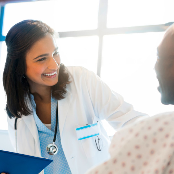Smiling a doctor greeting a patient