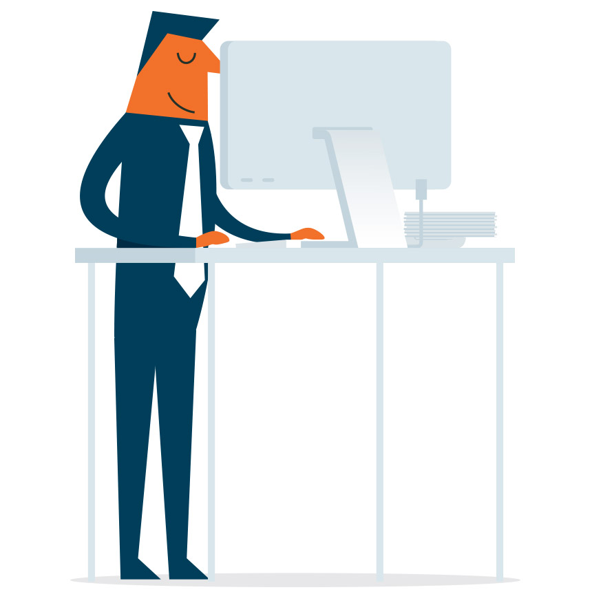 Image of someone working on a laptop using a standing desk.