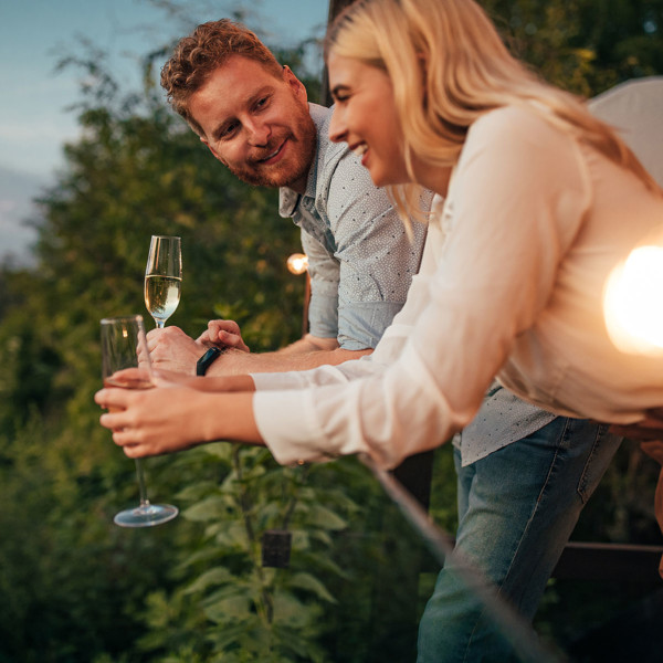 Image of a couple sharing wine on a date.