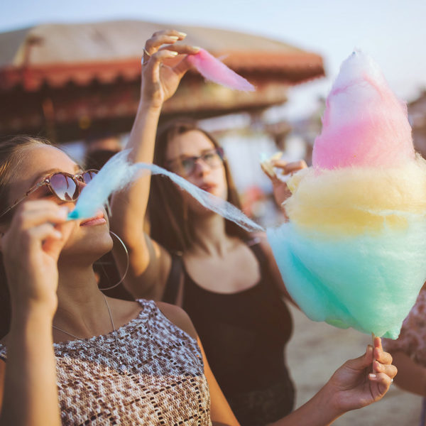 Image of two women eating cotton candy