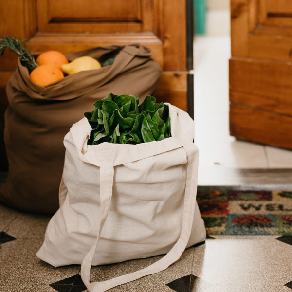 Bag of produce in doorway ready to give to those in need
